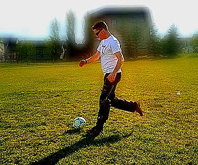 Reid Robinson, XLEG founder, playing soccer wearing hands free knee crutch — demonstrating active recovery with crutch alternative, Calgary Canada