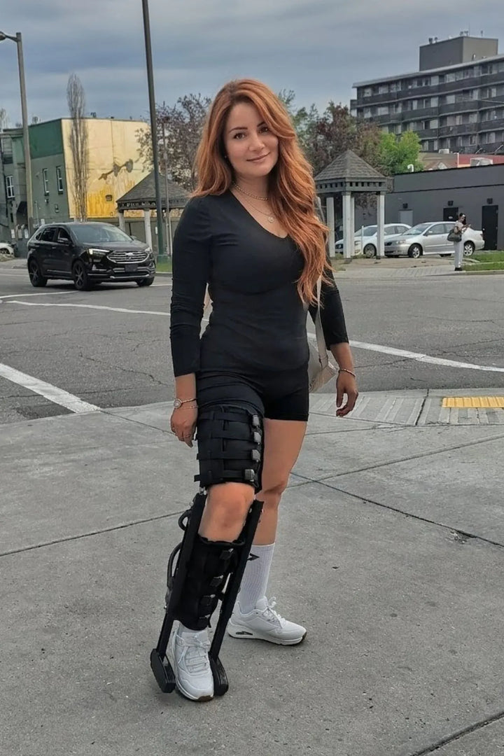 Woman going for a walk using XLEG hands free knee crutch alternative — hands free mobility aid for lower leg recovery, Calgary Canada